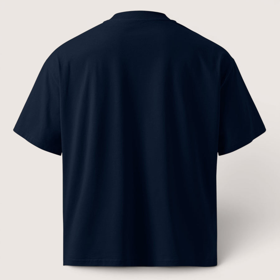 ETHIKKALL T-shirt bleu marine ample en coton biologique avec épaules tombantes et col rond.