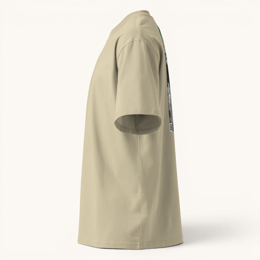 ETHIKKALL T-shirt ample beige en coton biologique avec col montant et épaules tombantes, idéal pour le streetwear.