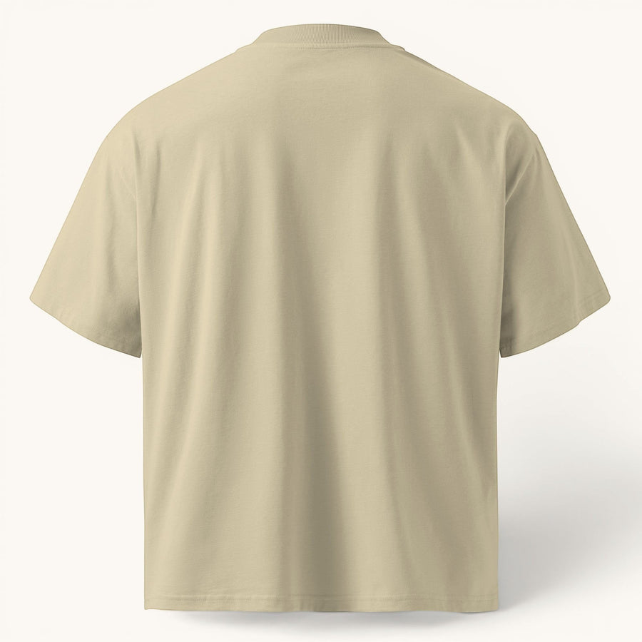 ETHIKKALL T-shirt ample beige en coton biologique avec épaules tombantes et col rond pour un style streetwear.