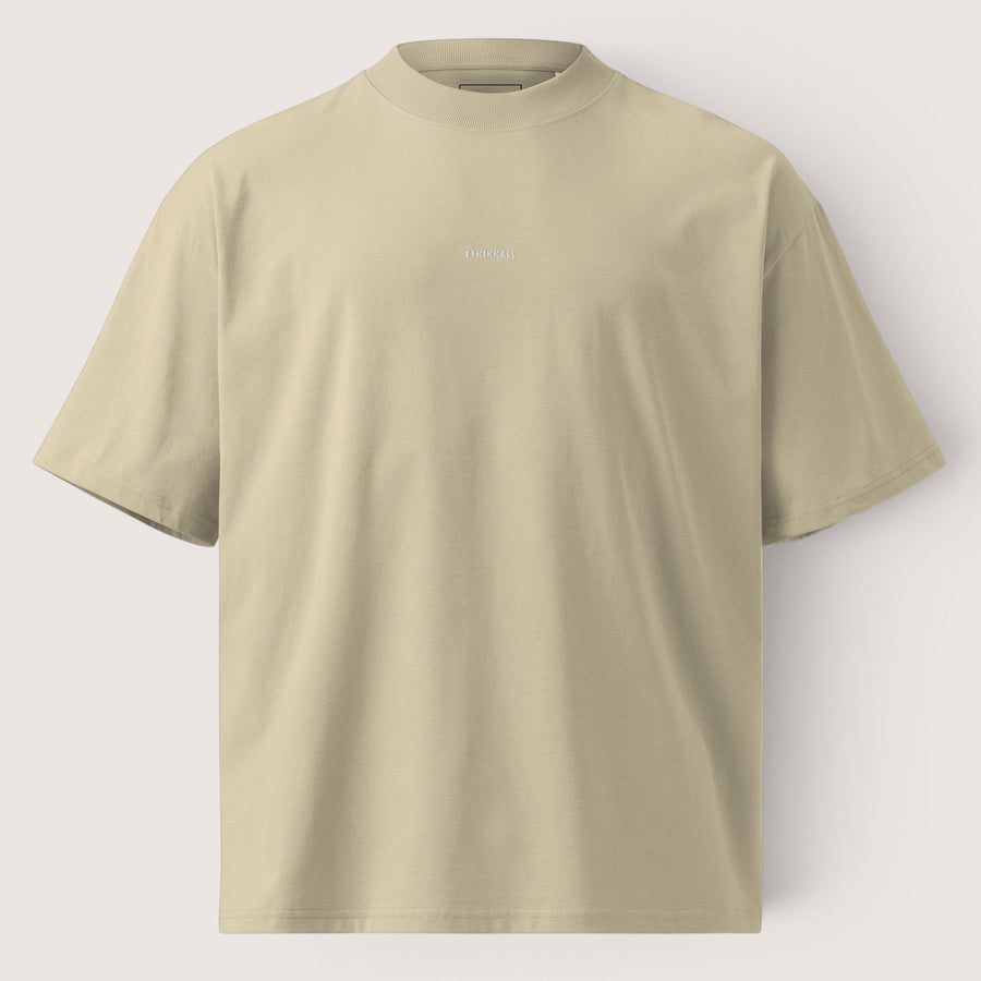ETHIKKALL t-shirt ample beige en coton biologique avec logo discret sur le devant et col rond.