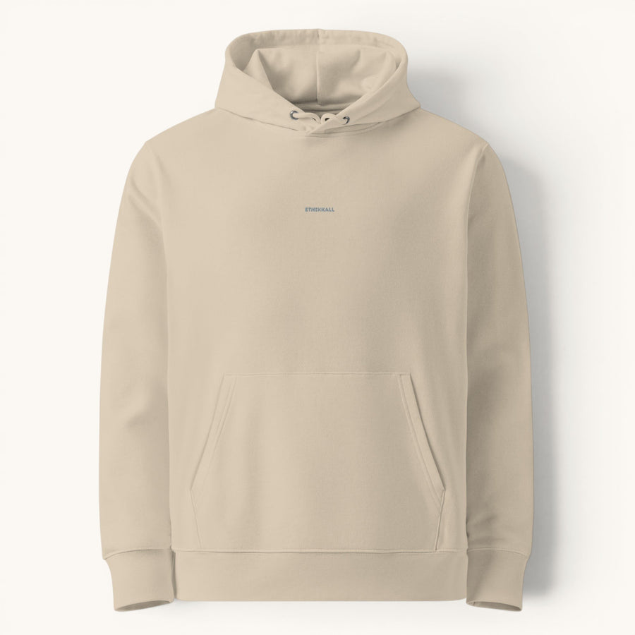 Sweat à capuche unisexe ETHIKKALL en coton organique beige, avec cordon de serrage, poche kangourou et logo discret brodé.