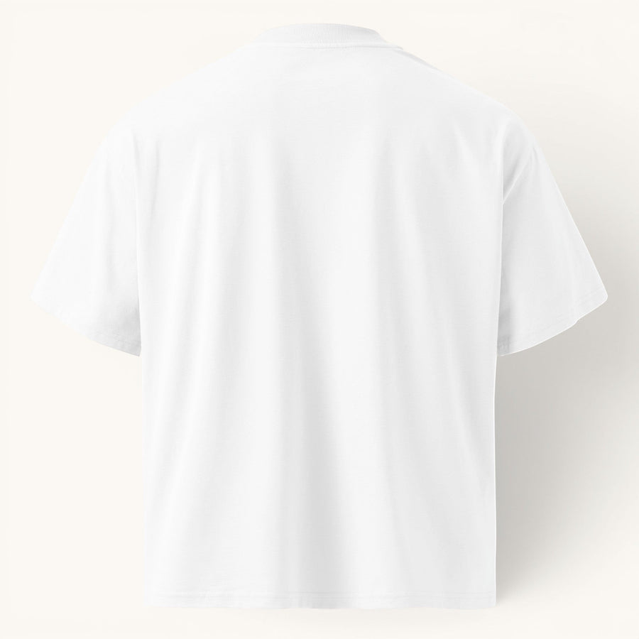ETHIKKALL T-shirt blanc ample en coton biologique avec épaules tombantes et col rond.