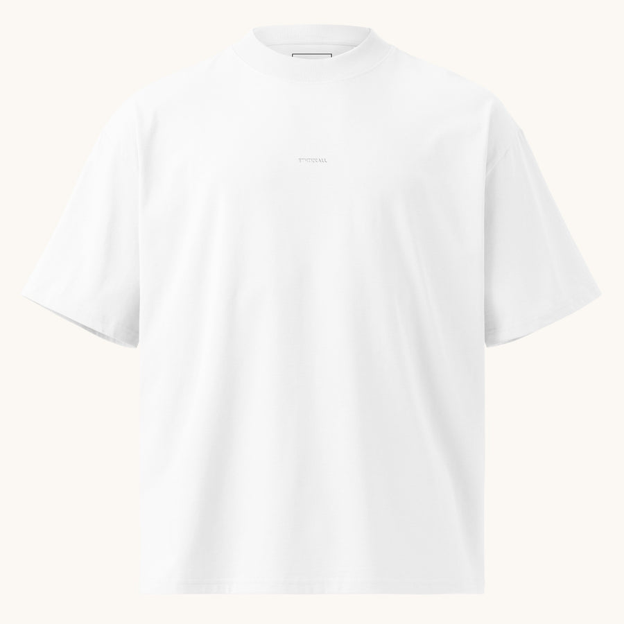 ETHIKKALL T-shirt blanc ample en coton biologique avec col montant et épaules tombantes, idéal pour le streetwear.