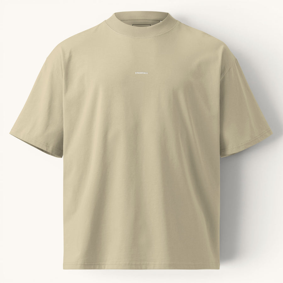 ETHIKKALL T-shirt ample beige en coton biologique avec col montant et épaules tombantes, idéal pour le streetwear.