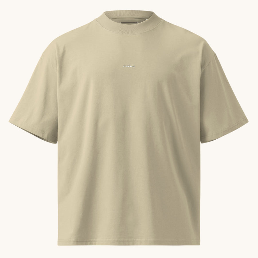 ETHIKKALL T-shirt ample beige en coton biologique avec col montant et épaules tombantes, idéal pour le streetwear.