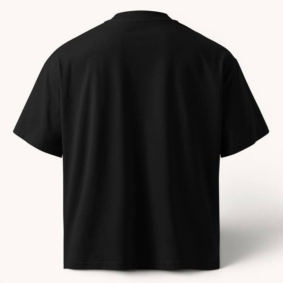 ETHIKKALL T-shirt noir ample en coton biologique avec épaules tombantes et col rond.