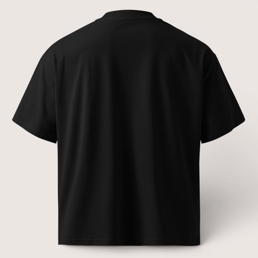 ETHIKKALL T-shirt noir ample en coton biologique avec épaules tombantes et col rond.
